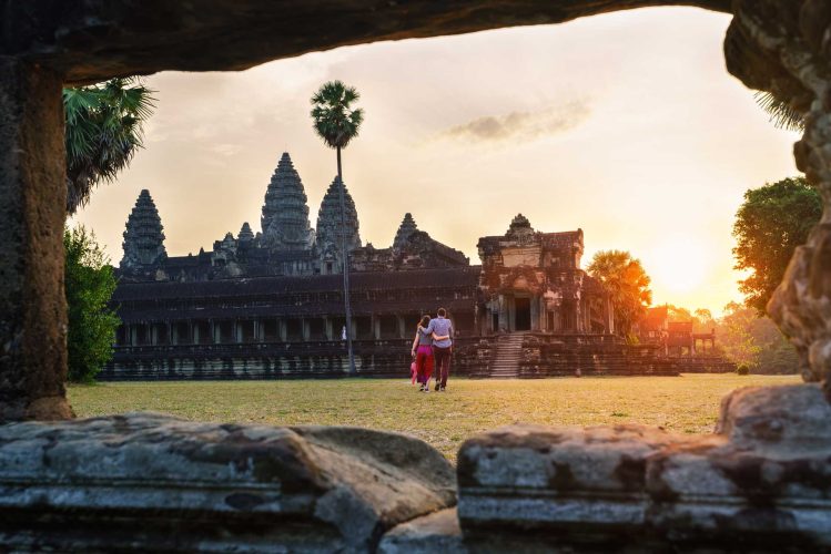 Travel,Couple,In,Angkor,Wat,At,Sunrise,Moment,,Siem,Reap, Travel couple in Angkor Wat at sunrise moment, Siem Reap, Cambodia